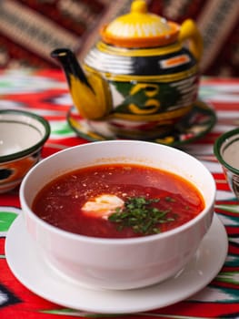 Borscht. Russian soup made from meat, beets, potatoes and served with sour cream. Asian style. High quality photo
