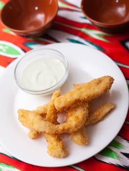 chicken nuggets - and breaded fried chicken served with a creamy sauce. Asian style. High quality photo