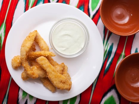 chicken nuggets - and breaded fried chicken served with a creamy sauce. Asian style. High quality photo