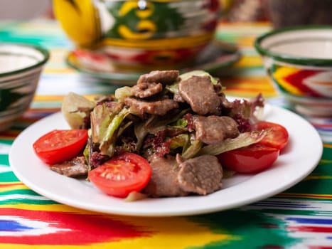 Uyghur fried meat with pepper and vegetables. Asian style. High quality photo