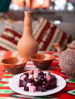 Beetroot and cheese salad with pine nuts dressed with butter. Asian style. High quality photo