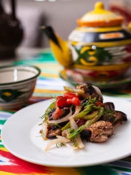 warm salad of green and red peppers, meat, eggplant, onions and tomatoes Asian style. High quality photo