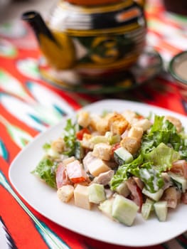 Tomato, cucumber, sweet pepper and onion salad, seasoned with oil. Asian style. High quality photo