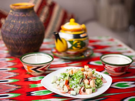 Tomato, cucumber, sweet pepper and onion salad, seasoned with oil. Asian style. High quality photo