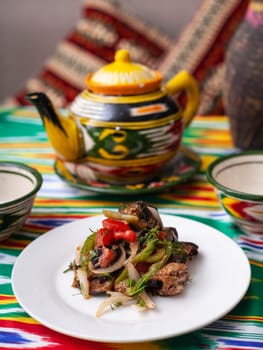 warm salad of green and red peppers, meat, eggplant, onions and tomatoes Asian style. High quality photo