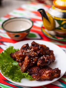 fried Chicken drumsticks in an oriental sauce. Eastern cuisine. High quality photo