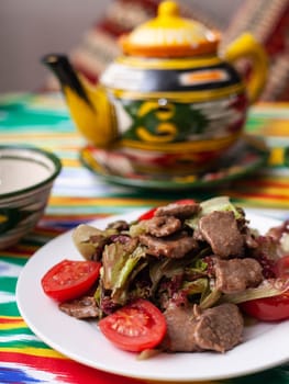 Uyghur fried meat with pepper and vegetables. Asian style. High quality photo