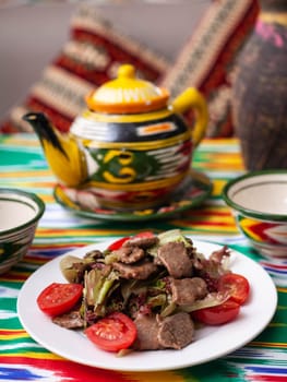 Uyghur fried meat with pepper and vegetables. Asian style. High quality photo