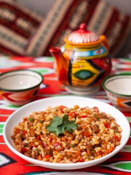 An oriental dish lagman - homemade noodles fried with meat and vegetables. Eastern cuisine. High quality photo