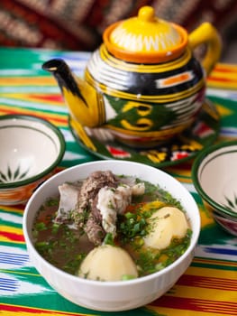 Surpa Soup from Boiled beef, potatoes and onions according to an oriental recipe. Eastern cuisine, national dish. High quality photo