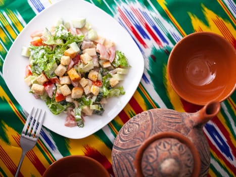 Tomato, cucumber, sweet pepper and onion salad, seasoned with oil. Asian style. High quality photo