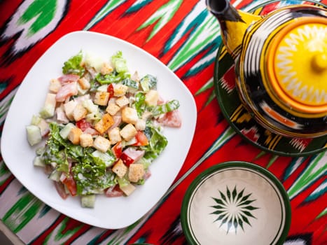 Tomato, cucumber, sweet pepper and onion salad, seasoned with oil. Asian style. High quality photo