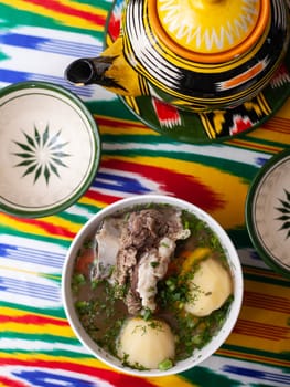 Surpa Soup from Boiled beef, potatoes and onions according to an oriental recipe. Eastern cuisine, national dish. High quality photo