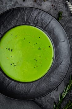 broccoli cream soup with pieces of chicken fillet