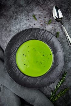 broccoli cream soup with pieces of chicken fillet