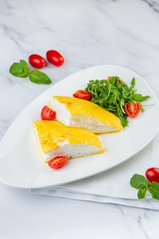 French tall omelette with arugula and cherry tomatoes