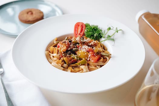 udon noodles with sesame seeds and herbs