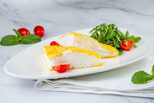 French tall omelette with arugula and cherry tomatoes