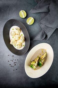 cooked cauliflower in mushroom sauce and broccoli