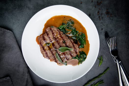 beef steak with gravy and herbs