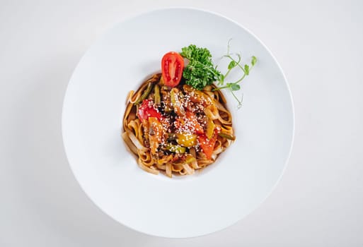 udon noodles with sesame seeds and herbs