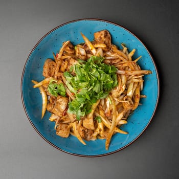 Fried beef intestines with vegetables and herbs