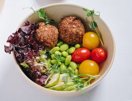 meatballs with beans, herbs, cherry tomatoes and sauce