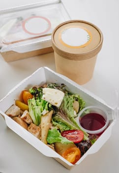 food in containers. proper nutrition, daily diet, weight loss. soup, drink, salad, steak.