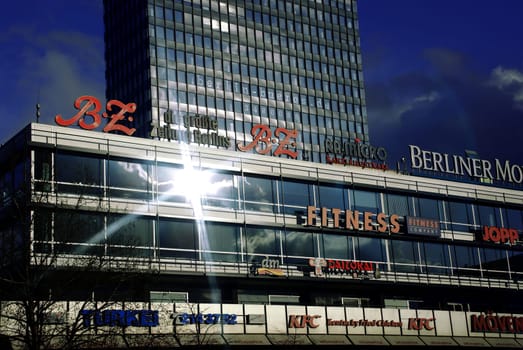 Europa-Center at Breitscheidplatz in Berlin * Snapshot from the moving car with SLR (i.e. without display info preview image) * I manipulated the time of day a little * the sun reflex star is real ***