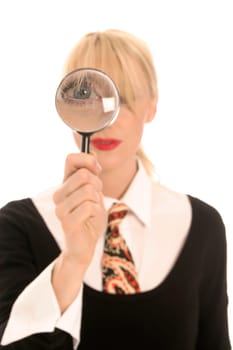 Young blonde woman with magnifying glass