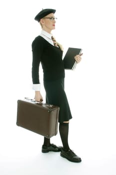 Young woman with suitcase and books