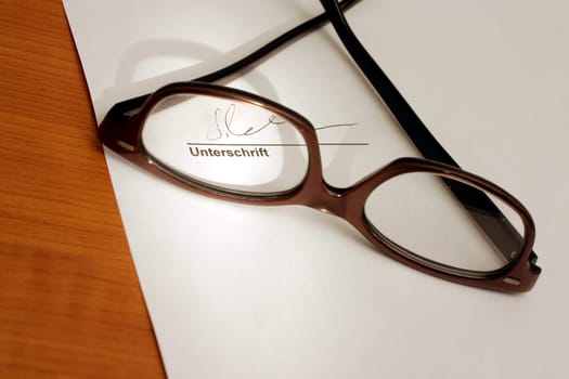 Glasses with lettering signature