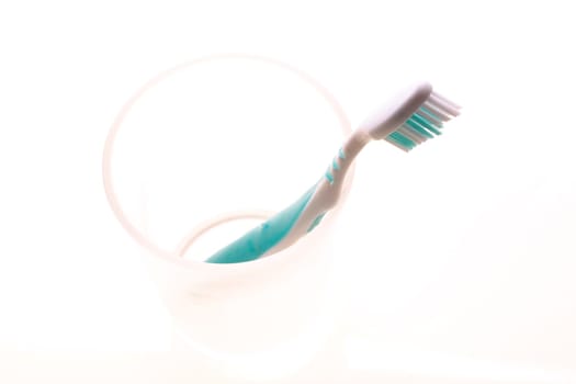 Toothbrush with cup