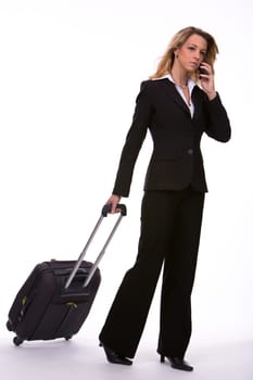 Business woman with travel trolley and mobile phone