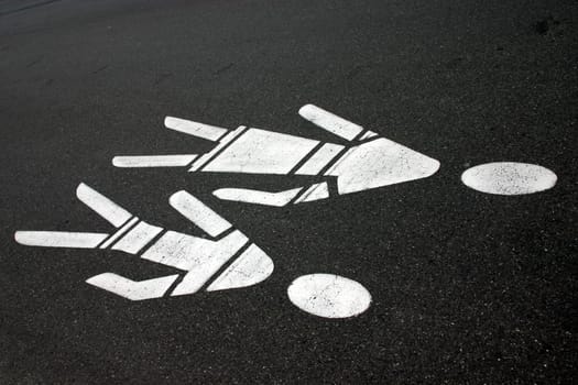 Mother-and-child signs on tar