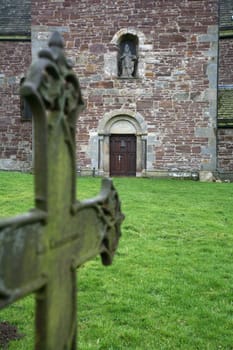 Old grave cross in front of the portal of St. Kilian's Church in Lügde (Krreis Lippe,North Rhine-Westphalia)