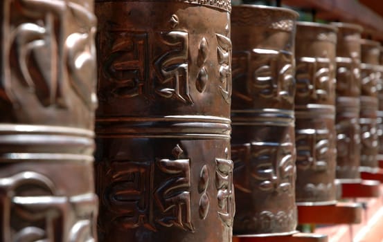In Buddhism,prayer wheels are rotated to link physical activity and mental-spiritual content
