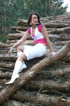 Woman on tree trunks