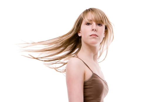 Waving hair of a young woman