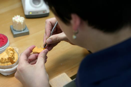Young woman in dental laboratory