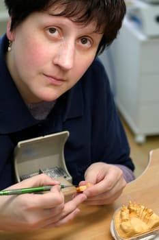 Young woman in dental laboratory