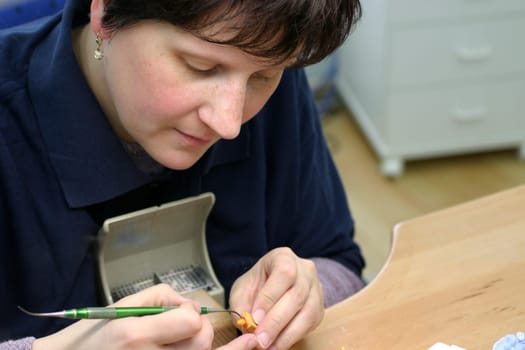 Young woman in dental laboratory