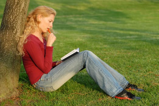 Young woman taking notes