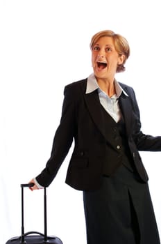 Young pretty lady/stewardess happily laughing with trolley exposed against white background.