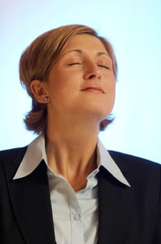 Young pretty woman with office clothes dreaming away with relish