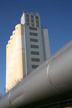 With grain silos of a mill