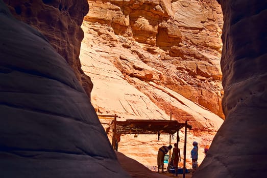 After hours of climbing through the canyon,I was overwhelmed by the Bedouins,who dragged water and served tea for the tourists....
