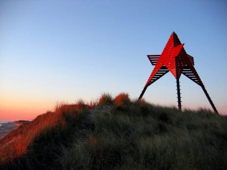 The landmark of Vedersø Klit is this beacon (sømærke),a triangular-shaped wooden monument about 12 meters high. These sea marks were erected around 1880 at intervals along the Jutland coast and were used for shipping,especially the F