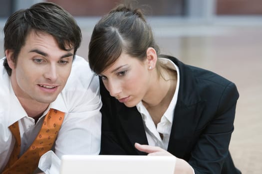 Man and woman with laptop
