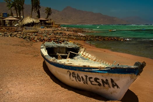 It's hardly usable anymore,but it's picturesque,much nicer than the new plastic boats that are horrible everywhere...